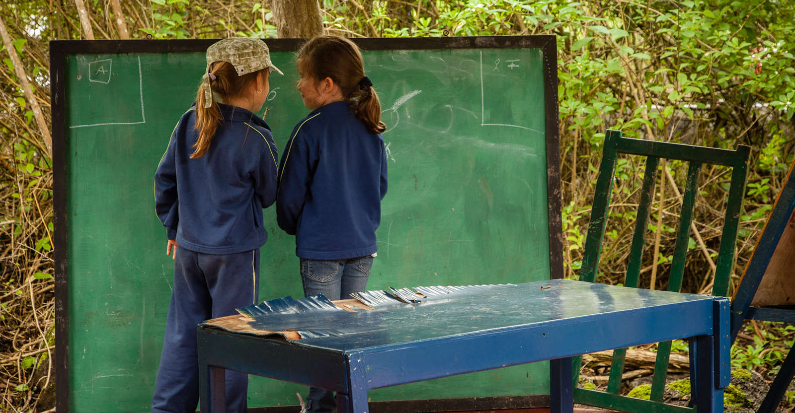 Two young students participate in an activity in the Education for Sustainability Program, by Jennifer Davison